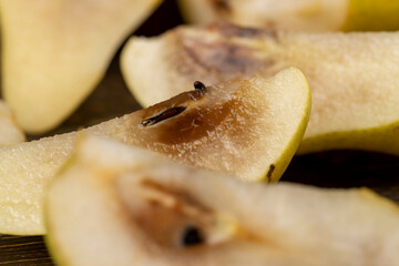 part of the rotted inside of a ripe pear, side view