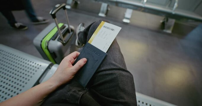 Crowded International Airport Terminal: Passenger with Suitcase, Passport and Plane Ticket Sitting in Departure Lounge of Airline Hub, Then Walking to Gate for Boarding Flight. POV First-Person View.