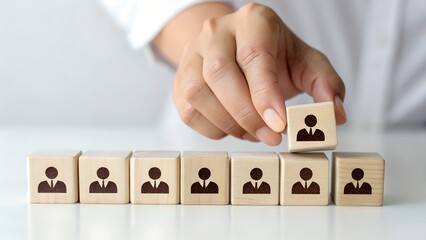 Customer retention concept. Inbound marketing strategy. Attracting potential customers. Hand puts wooden cubes with magnet attracts customer icons on beautiful grey background and copy space. Loyalty