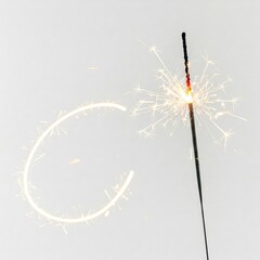Obraz premium 4th of July sparkler stick on a solid white background