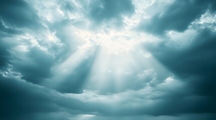 Dramatic sky scene with brilliant sunlight rays piercing through clouds.