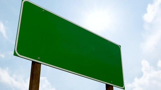 4k Blank Green Road Sign Against A Blue Sky with Some Clouds.