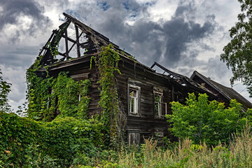 Abandoned and ruinous wooden countryhouse
