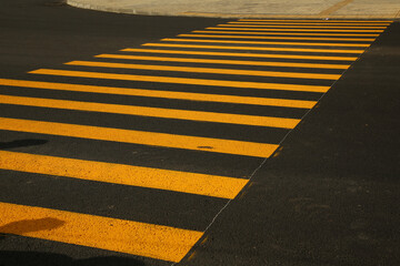 Pedestrian crossing yellow marking in the city. Road marking, repair, attention