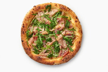 Delicious pizza with parma ham, rocket salad, pesto and parmesan on white background