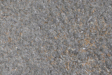 Old natural aged weathered oriented strand board OSB chipboard textured background, grunge taupe grey horizontal pattern copy space, large detailed dark vertical rustic ruined wooden macro closeup