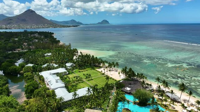 Aerial view of a beach resort in Flic en Flac, Mauritius with visible kayakers in the lagoon