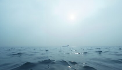 Distant ship on calm ocean under hazy sky