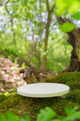 Podium in a natural setting surrounded by greenery, showcasing products in a serene outdoor environment
