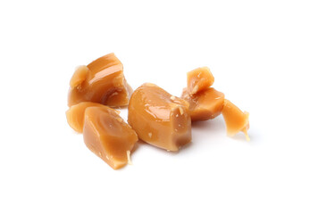 Tasty sweet caramel candies isolated on white