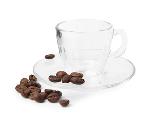 Aromatic coffee beans, cup and saucer isolated on white