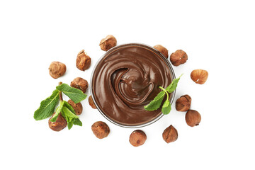 Tasty chocolate spread with mint in bowl and hazelnuts isolated on white, top view