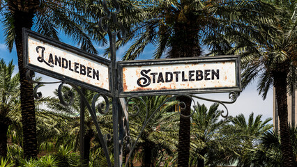 Fototapeta premium Signposts the direct way to city life versus country life