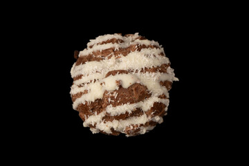 Profiteroles with coconut cream on a black background.