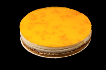 Orange cheesecake isolated on a white background.