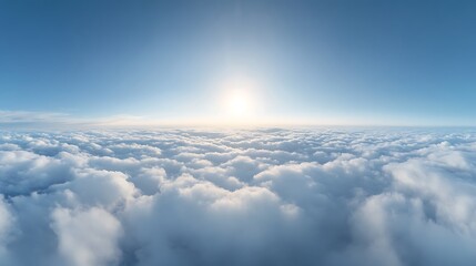 Fototapeta premium Serene panoramic view of soft white clouds against a bright blue sky with a radiant sun in the upper center illuminating the scene. .