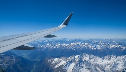 Fototapeta premium High mountain peaks seen from an airplane window