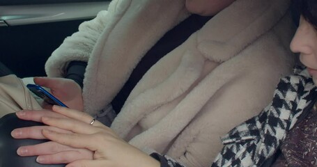 The video shows intimate moments between a woman and a child, and two women in a car, highlighting connection and companionship