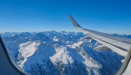 Fototapeta premium High mountain peaks seen from an airplane window