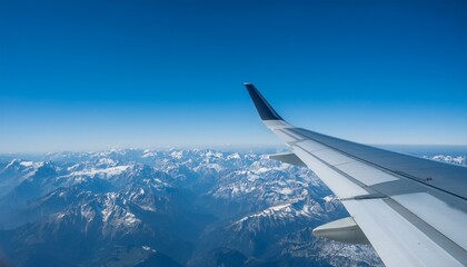 Obraz premium High mountain peaks seen from an airplane window