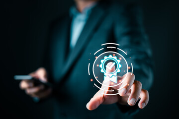 A businessman in a suit interacts with a glowing digital icon of a certificate featuring a checkmark, symbolizing quality assurance, certification, and trust in a modern digital environment.