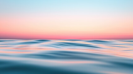 Obraz premium Sunset over a scenic bay with calm waves reflecting orange and pink hues