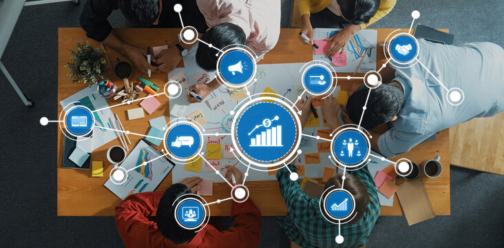 A diverse team engaging in a creative brainstorming session, utilizing visual data to drive marketing strategies while collaborating on innovative solutions in a bright workspace. Amity