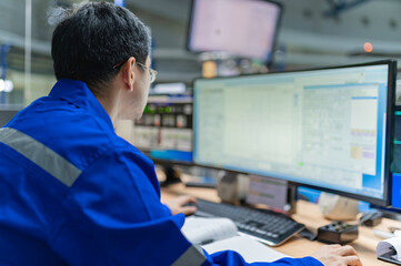 Engineer working at control room,Manager control system,Technician man monitoring program from a lot of monitor