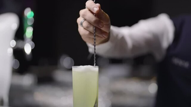 Expert Bartender Crafting a Cocktail