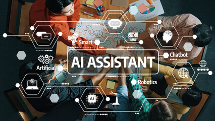 A diverse team collaborates around a table, developing concepts for AI assistants, showcasing elements of technology and innovation in a modern workspace. Amity