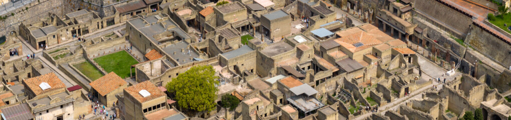 Fototapeta premium Aerial view of the remains and excavations of Herculaneum. It is an archaeological area of ​​an ancient Roman city, near Pompeii, in the province of Naples, Italy. It is a tourist destination.