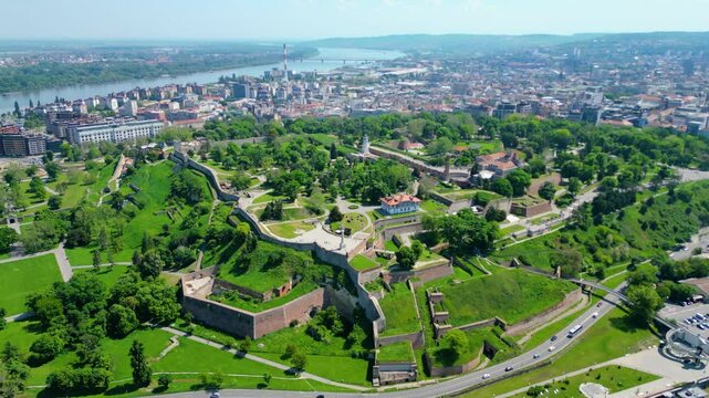 Aerial view of Belgrade where the Sava and Danube rivers meet. Visible landmarks include Kalemegdan Fortress (Beogradska tvrđava), city bridges, and U&scaron;će Park &mdash; a perfect urban-meets-nature panorama