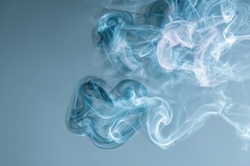 Obraz premium Abstract swirling smoke patterns in cool tones.