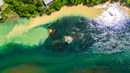 Aerial view of Bajina Bašta and the iconic Kućica na Drini (Drina River House), peacefully...