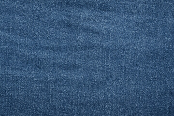 Fototapeta premium A textured denim fabric in deep blue hue, showcasing subtle variations and a soft feel. Ideal for fashion design, textiles, or creative projects emphasizing casual style.