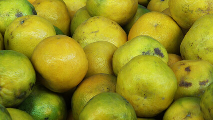 Ripe oranges displayed in a fruit stall