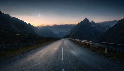 Asphalt road in mountains at night