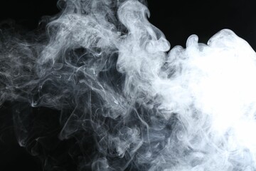 Beautiful white smoke flowing on dark background