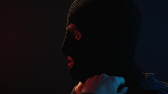 Man puts on balaclava, prepares to rob bank