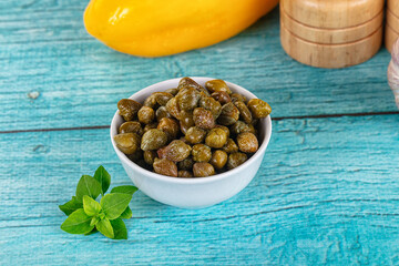 Pickled canned capers in the bowl