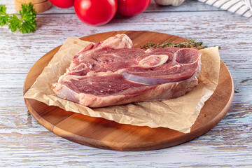 Raw lamb steak with bone