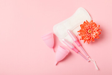 Menstrual cup on a bright background. Sanitary napkins, tampons and menstrual cup.Concept of...