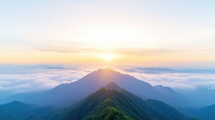 Fototapeta premium Sunrise over misty mountain peaks