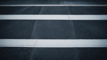 Fototapeta premium Urban crosswalk on asphalt road with pedestrian safety features