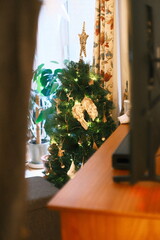 A highly detailed photo of a close up of a christmas tree in a box with artistic lighting. weather: . mood: moody and dramatic.