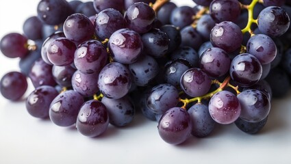 Fototapeta premium Isolated purple grape branch on white surface