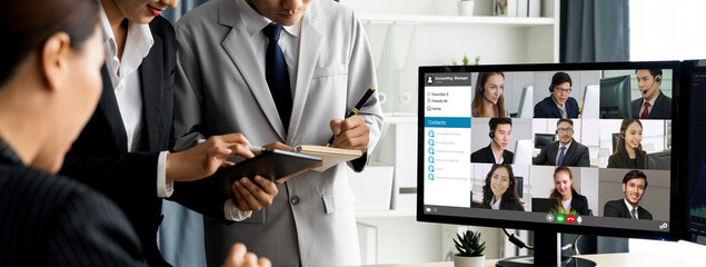 Business people on video conference for brisk virtual group meeting of corprate business office...