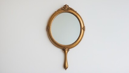Classic hand mirror displayed on a white backdrop