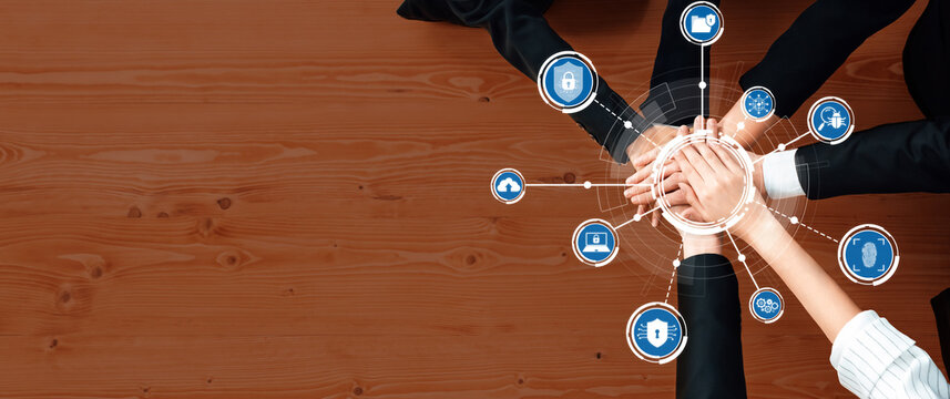 A top-down view of diverse hands joining together, symbolizing collaboration in cybersecurity. Technology icons representing security enhance modern business strategies and engagement. Amity