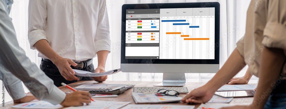 Fototapete Project planning software for brisk business project management on the computer screen showing timeline chart of the team project